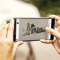 A close up image of a woman's hands holding a smartphone