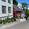 A photo of Telthusbakken street in Oslo, with it's wooden homes in a variety of colors.