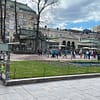 A photo of a small park in Helsinki, with a little pond in the foreground