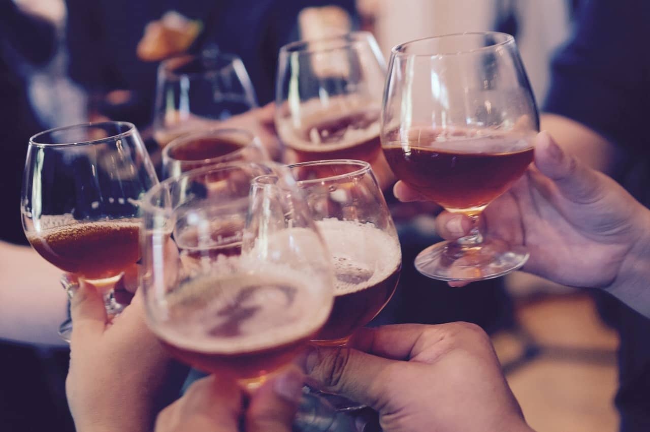 Hands holding beer glasses