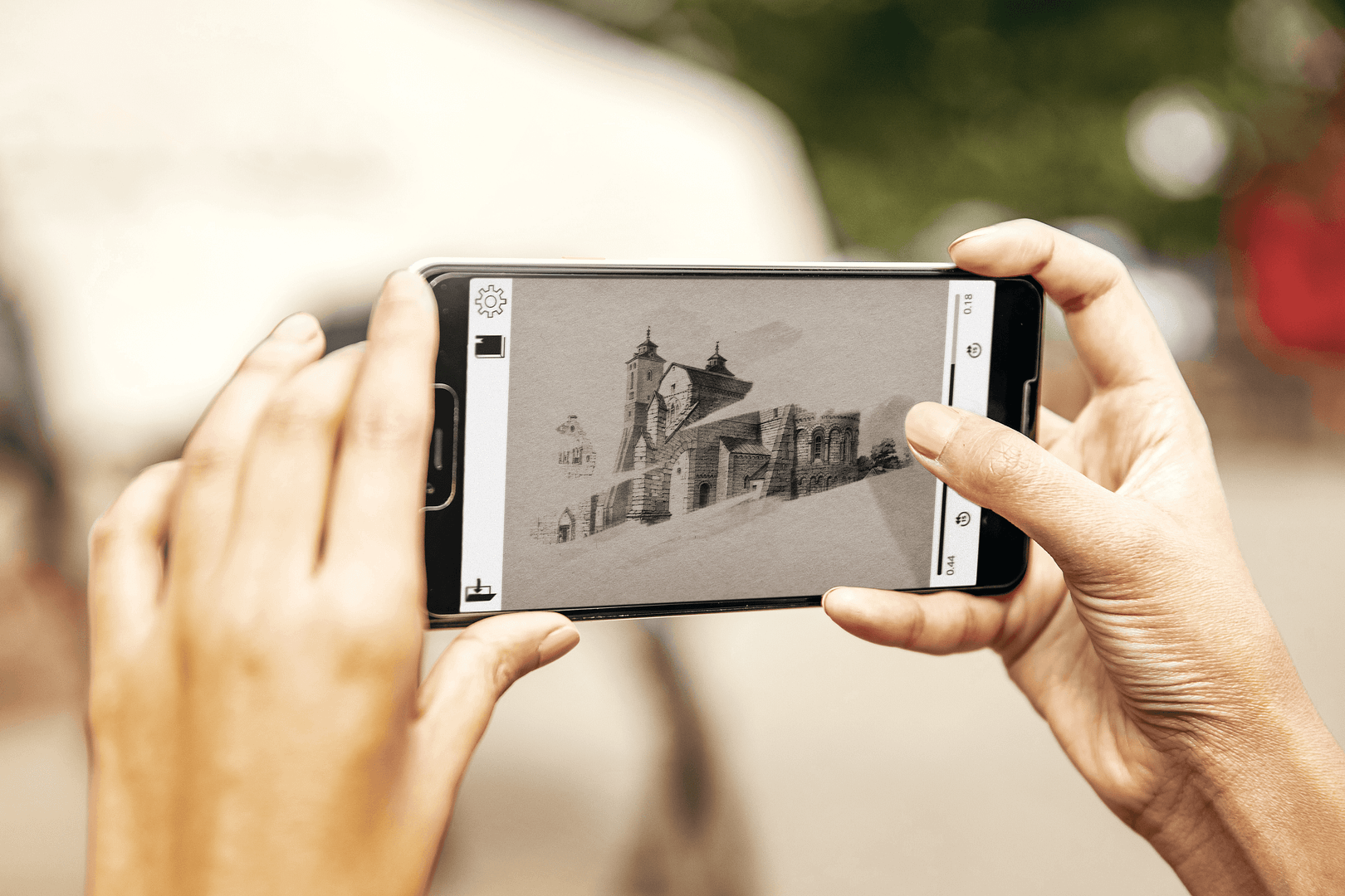 A close up image of a woman's hands holding a smartphone