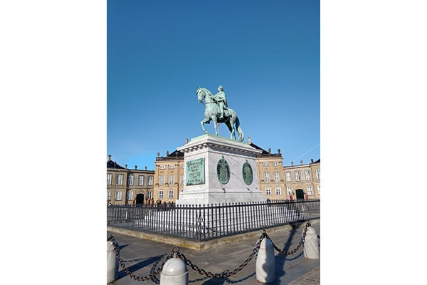 The statue of a man on a horse at Amalienborg castle in Copenhagen