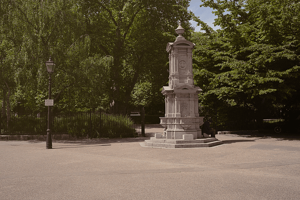 Outside Lincoln's Inn Park, with trees in the background and a fountain in the foreground