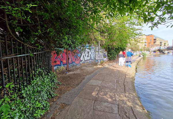 A photo of the towpath along the Regent's canal on a sunny spring day.