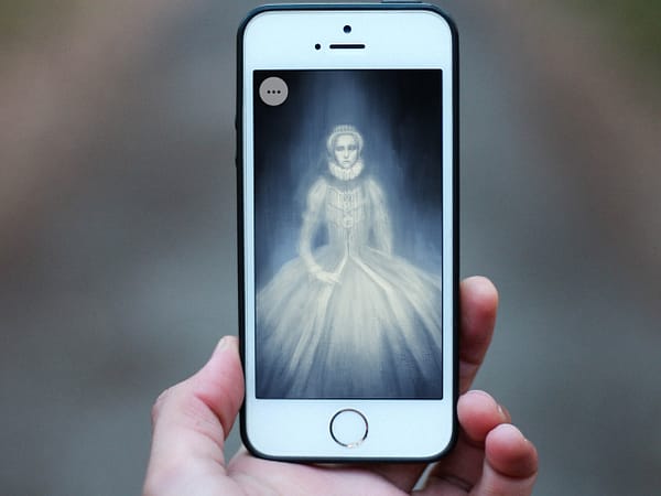 A close up of a hand holding a smartphone. On the screen is an illustration of a ghost queen.